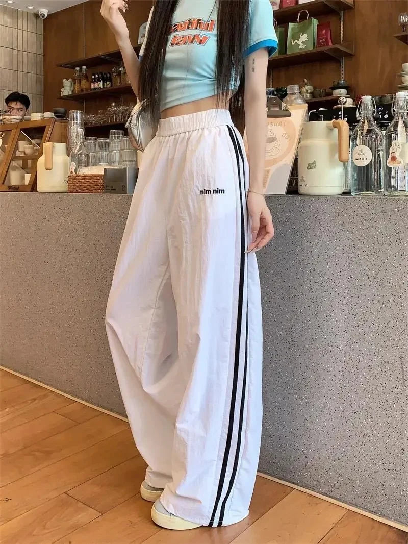 Pantaloni sportivi stile americano ad asciugatura rapida, estivi, nuovi, larghi, a righe, sottili, traspiranti, casual, a gamba larga, pantaloni lunghi da donna