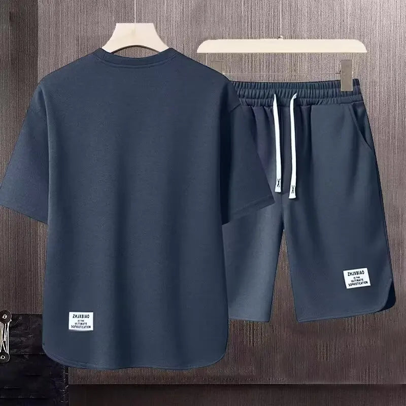 Completo estivo da uomo color kaki, stile americano, con t-shirt e pantaloncini stampati a cartoni animati, set di 2 pezzi, maglia a nido d'ape traspirante, abbigliamento sportivo da uomo.