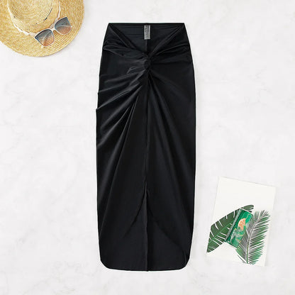 2025 Nuovo copricostume bikini lungo a tinta unita con spacco, abito da spiaggia sexy da donna con mezza gonna e bordo incrociato, abbigliamento casual alla moda.