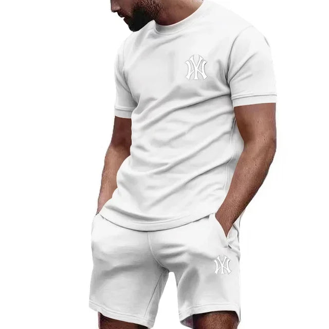 Completo sportivo da uomo a due pezzi 2026, composto da t-shirt a maniche corte e abbigliamento sportivo estivo per corsa e fitness.