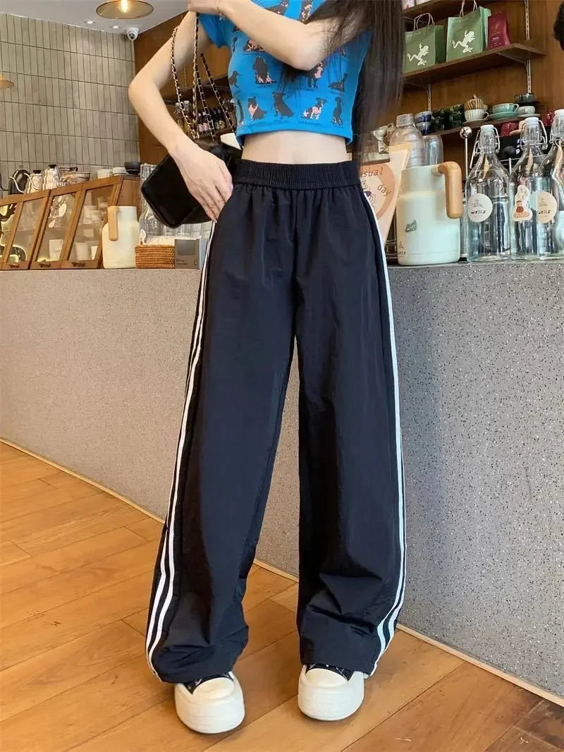Pantaloni sportivi da donna in stile americano ad asciugatura rapida, estivi, larghi, a righe, sottili, traspiranti, casual, a gamba larga, lunghi.
