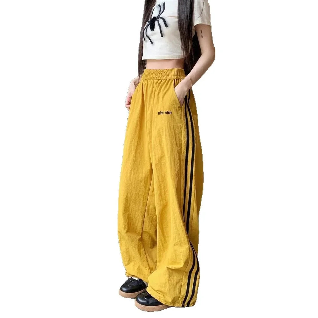 Pantaloni sportivi da donna in stile americano ad asciugatura rapida, estivi, larghi, a righe, sottili, traspiranti, casual, a gamba larga, lunghi.