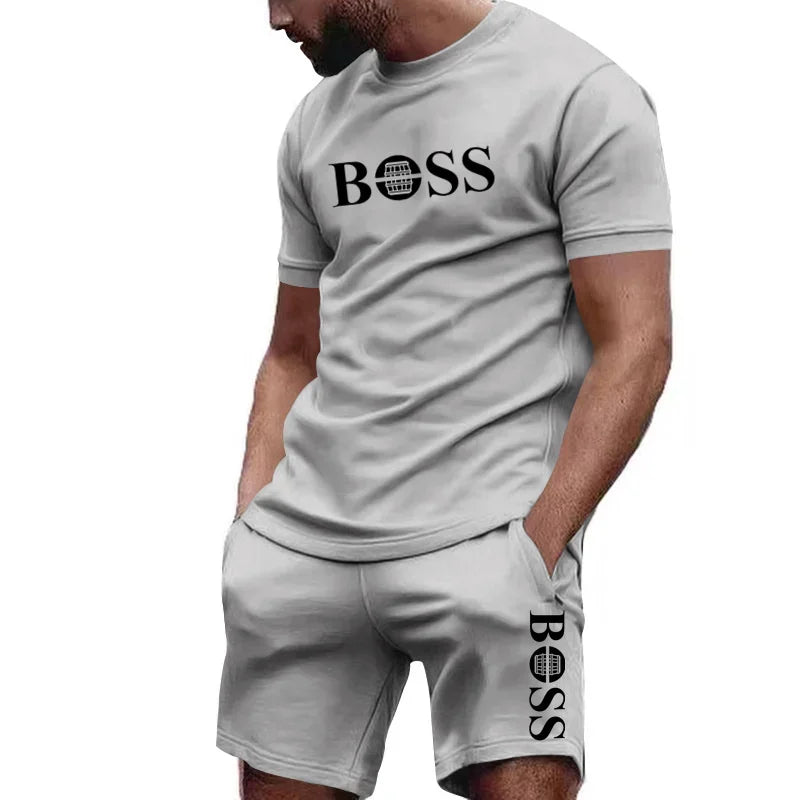 Completo sportivo da uomo a due pezzi con t-shirt a maniche corte e pantaloni, ideale per corsa e fitness, collezione estate 2026 con grandi sconti.