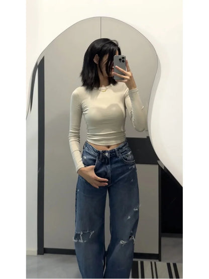 Jeans da donna ETJ Primavera 2025, nuova collezione 1975, a vita alta, silhouette curva, 100% cotone, con effetto strappato e gamba larga.