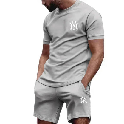Completo sportivo da uomo a due pezzi 2026, composto da t-shirt a maniche corte e abbigliamento sportivo estivo per corsa e fitness.