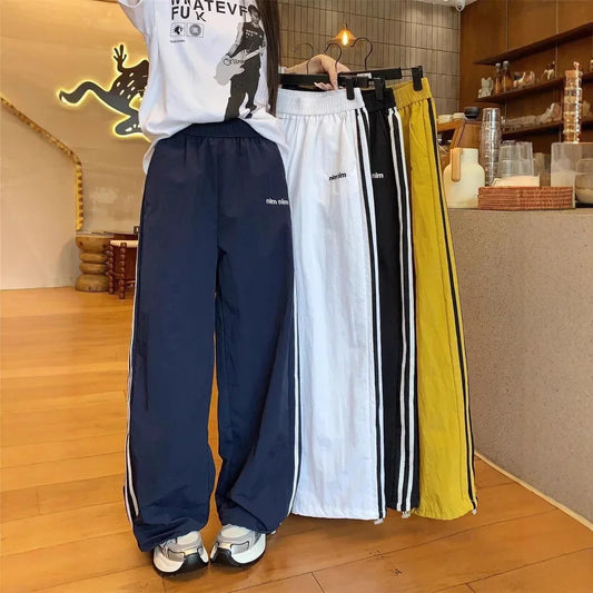 Pantaloni sportivi stile americano ad asciugatura rapida, estivi, nuovi, larghi, a righe, sottili, traspiranti, casual, a gamba larga, pantaloni lunghi da donna